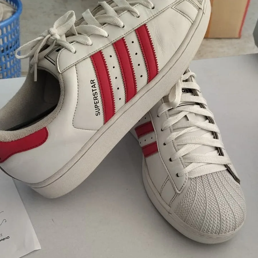 The same adidas superstar sneakers after Wash4You cleaning