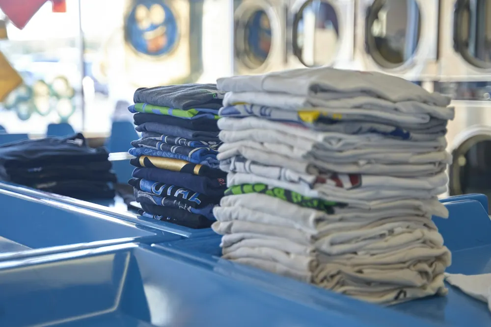 Neatly folded household textiles on a packing table