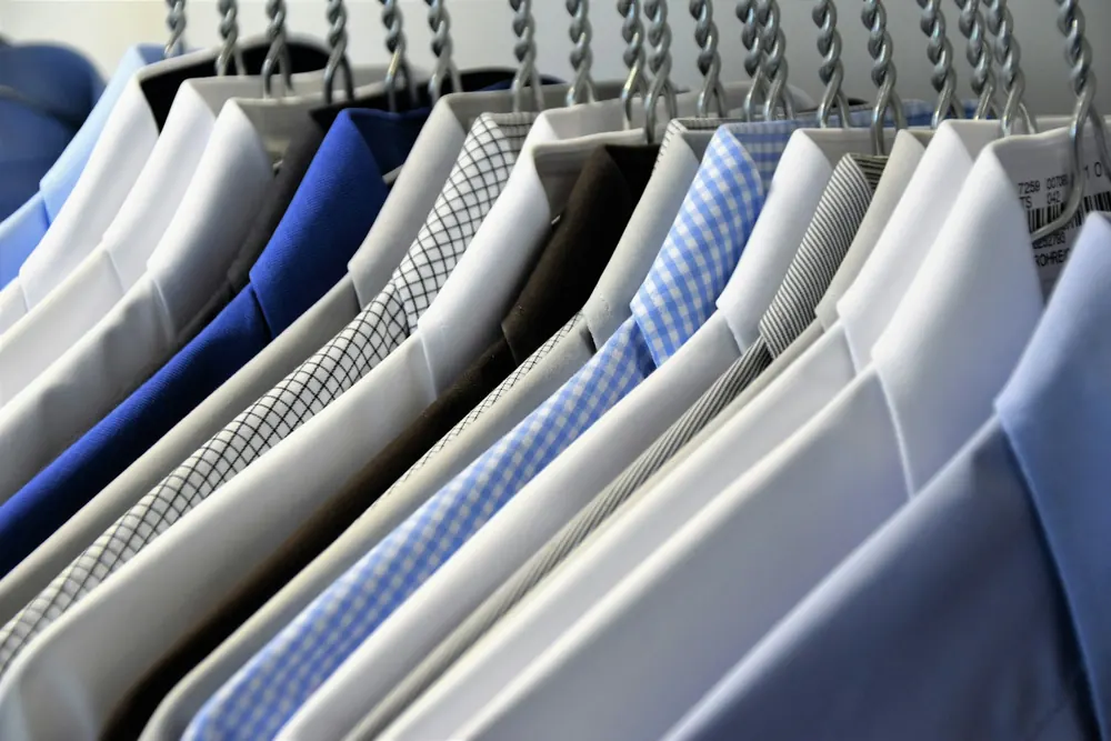 Pressed shirts hanging on a rail