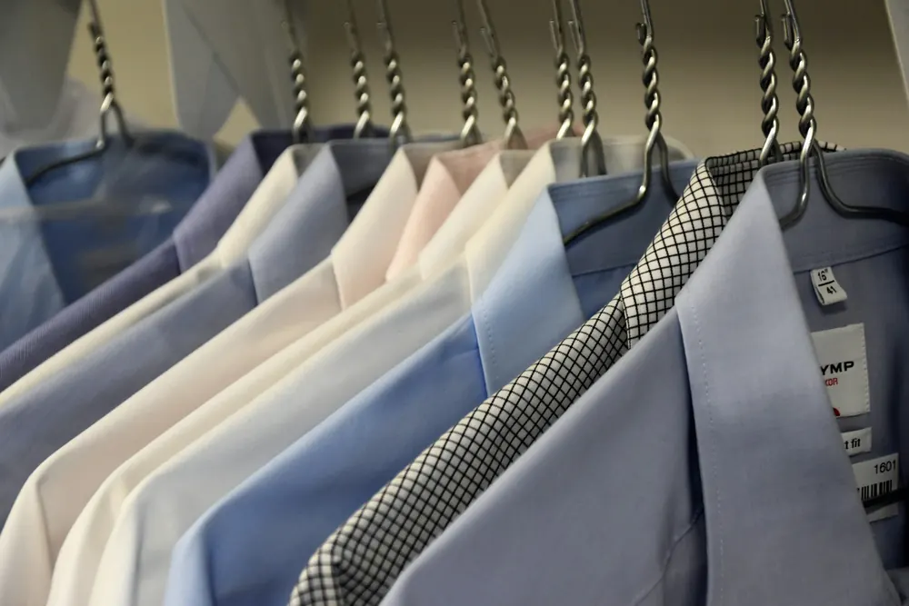 Tailored jackets hanging after professional dry cleaning